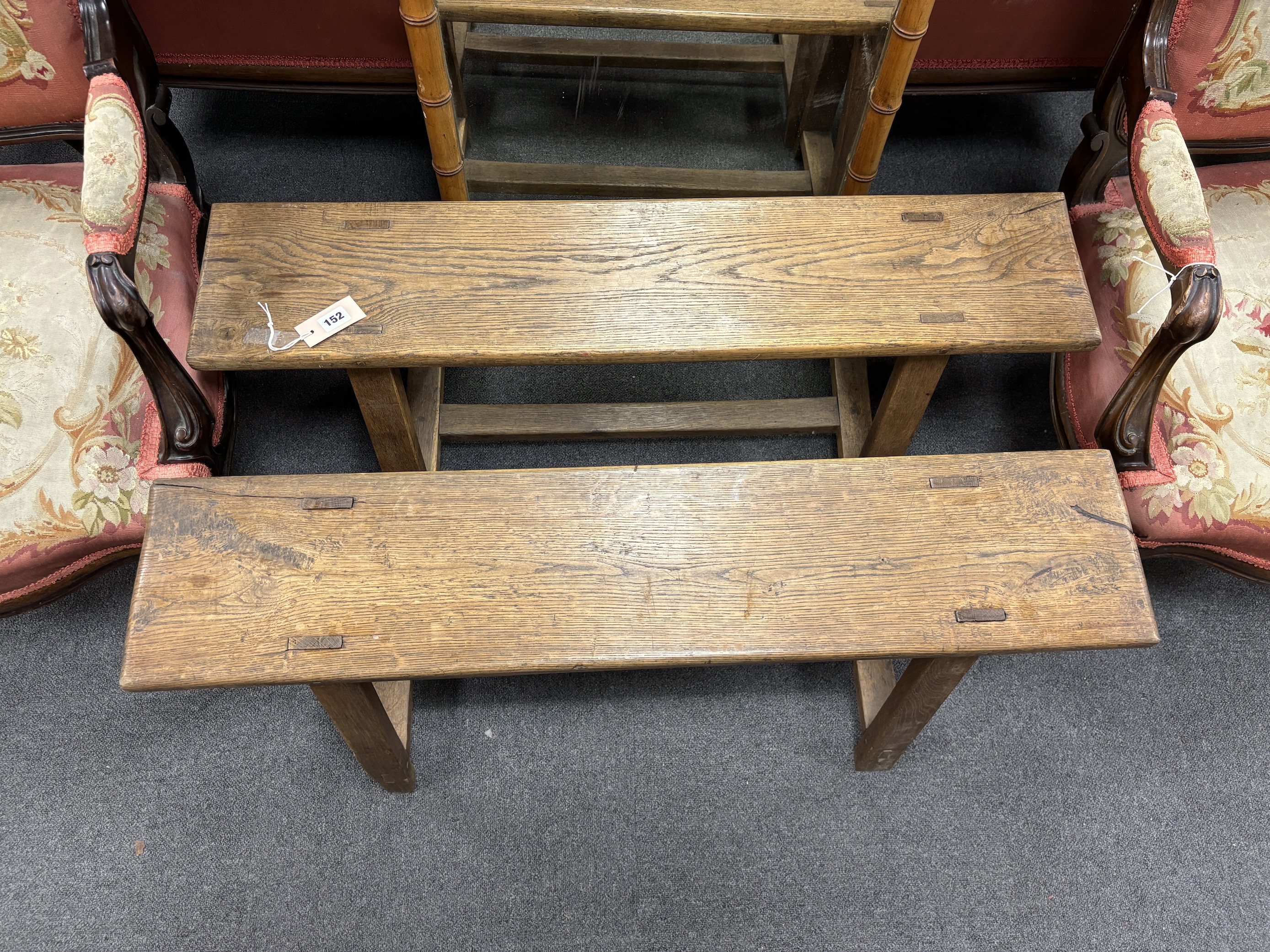 A pair of small late 19th century French oak benches, width 101cm, depth 21cm, height 46cm